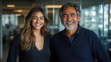Two cheerful professionals stand side by side, showcasing their warm smiles in a contemporary office setting photo