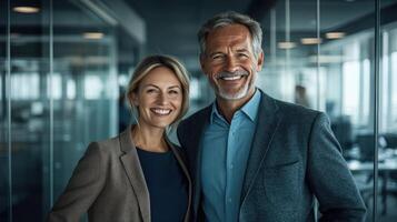 Two professionals stand together in a contemporary office, smiling confidently after a productive session photo