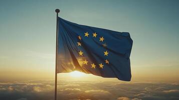 A flag representing Europe flutters in the wind during sunrise, casting a hopeful glow over the clouds photo