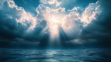 Sunlight breaks through dramatic clouds over a calm ocean, creating a serene and beautiful atmosphere photo