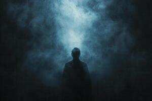 Mysterious figure standing in smoke-filled atmosphere during nighttime in an eerie, atmospheric setting photo
