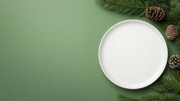 Christmas tree and plate on green background photo