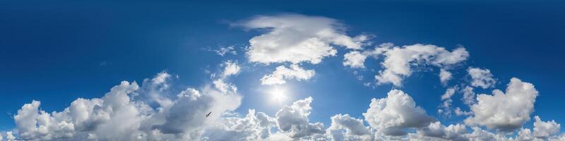 Blue sky panorama with puffy Cumulus clouds. Seamless hdr pano in spherical equirectangular format. Sky dome or zenith for 3D visualization, game and sky replacement for aerial drone 360 panoramas. photo