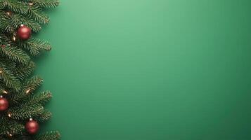 Festive Christmas Background with Evergreen Tree Branches and Red Ornaments on Green Backdrop for Seasonal Holiday Design Projects photo