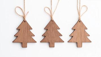 Wooden christmas tree decorations hanging on string photo