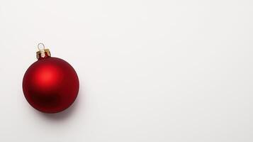 Minimalist Christmas Design Featuring a Red Ornament on Clean White Background for Modern Holiday Aesthetics and Seasonal Decor Concepts photo