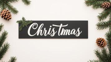 Elegant Black Sign with White Cursive Christmas Text and Evergreen Accents Perfect for Festive Holiday Decor and Minimalist Design photo