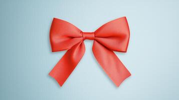 Elegant Red Satin Ribbon Bow Isolated on Light Blue Background for Gift Wrapping, Celebrations, Holidays, and Invitations in a Classic and Minimalist Style photo