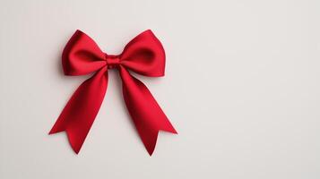 Elegant Red Satin Ribbon Bow Isolated on White Background for Holidays and Gift Design with Smooth Texture and Sophisticated Look photo