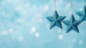 Sparkling Blue Star Christmas Ornaments Hanging Against a Soft Bokeh Background With Festive Holiday Atmosphere and Elegant Lighting for Seasonal Decoration and Design Inspiration photo