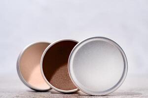 Mocha Mousse - color of the year 2025. colorful lip balms in round tin cases , mockup design photo