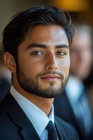 A confident young businessman networking at an industry event, engaging with peers and potential clients. photo