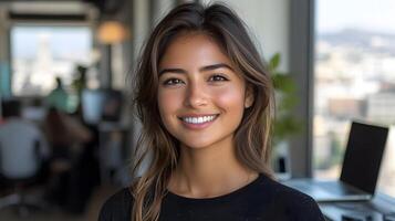 Woman coding on a laptop in a modern office, focused expression, tech business setting, vibrant workspace photo