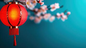 vibrant red lantern illuminated against turquoise background, surrounded by delicate blossoms, creates festive atmosphere photo