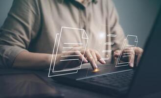 Document management system, DMS. Woman use laptop in business arrange database folder in office. Concept of cyberspace security software use in paperwork on cloud server, documentation platform report photo