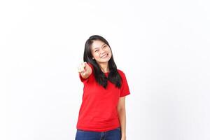 Smiling and Pointing at camera or you, want you gesture Of Beautiful Asian Woman wearing red shirt Isolated On White Background photo