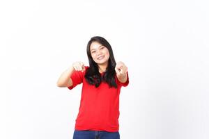 Smiling and Pointing at camera or you, want you gesture Of Beautiful Asian Woman wearing red shirt Isolated On White Background photo