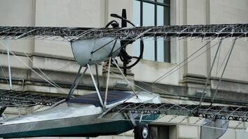 The old airplane is being exhibitted in front of the museum photo