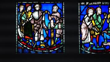The colorful windows view with the religious story on it photo
