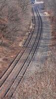 One old railway iron track across in the valley among the mountains photo