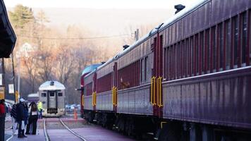 The railway station view with the wagons stopping on the iron tracks photo