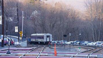 The railway station view with the wagons stopping on the iron tracks photo
