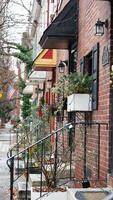 The street view with the christmas decoration along the doors and windows during the christmas days photo