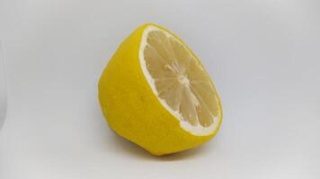 A Fresh Lemon Half set against a pristine White Background, exuding vibrant energy and appeal photo