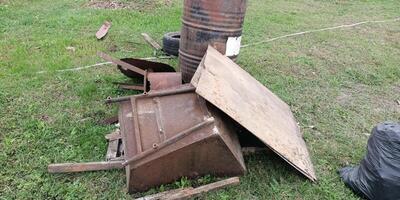 Discarded Metal Pieces Found in an Open Area, left behind and waiting for cleanup actions photo
