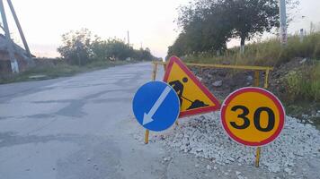 Road Construction Signs that Indicate Speed Limit Regulations and Directional Guidance for Drivers photo