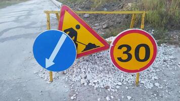 Road Work Signs that Indicate Construction Areas and Set Specific Speed Limits for Drivers photo