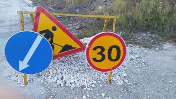 Be aware of Construction Warning Signs indicating the Speed Limit in the area ahead photo