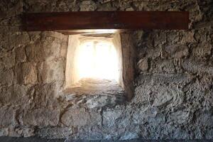 A Stone Wall featuring a Window Opening is a notable feature in Historical Architecture photo