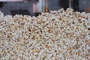 Experience the Delicious Popcorn Display at a Vibrant Snack Stand, Perfect for Everyone photo