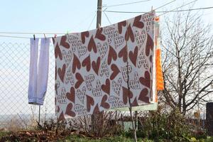 A Colorful Clothesline Adorned with a Charming Heart Pattern for Your Enjoyment and Delight photo