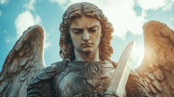 An angel statue with a sword in its hand photo