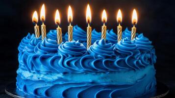 Birthday Cake with Golden Candles and Blue Frosting photo