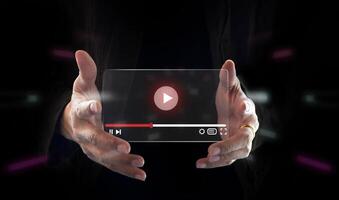 Live marketing concept. Businessman hand holding transparent screen and tuching on start button to run clip. photo