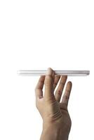 a hand holding a white smartphone on a white background photo