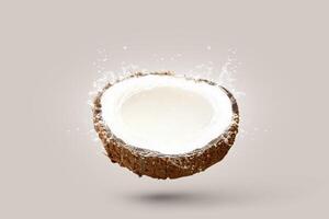 Half coconut cracked coconut with water splash top view isolated background - Clipping path photo