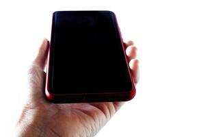 a person holding a red iphone in their hand photo