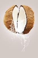 Coconuts water splash top view isolated on the white background photo