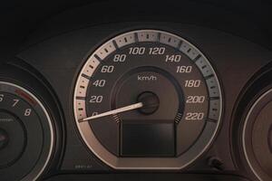 Close up of a dashboard with speedometer and gauges photo