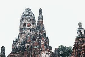 the buddha statue is in front of the temple photo