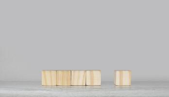 wooden blocks on a table with a gray background photo