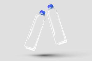 two empty plastic bottles with blue caps on a white background photo
