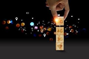 5g technology concept with hand holding 5g blocks photo