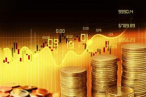 gold coins and stock market graph photo