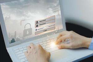 a person is typing on a laptop with a security icon on it photo
