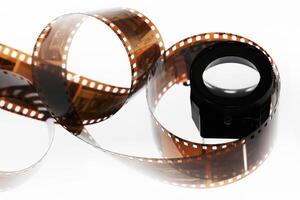 a roll of film is shown with a camera lens photo